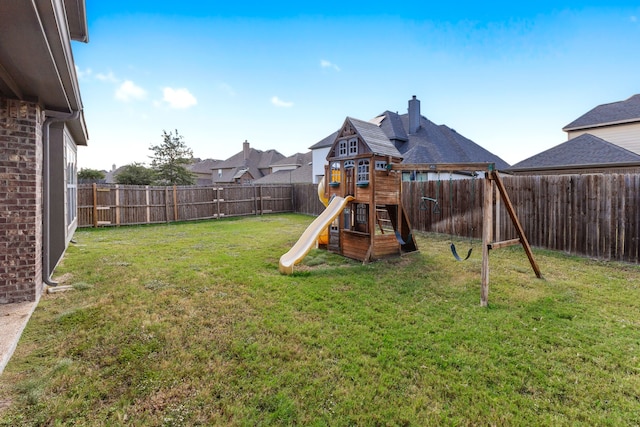 view of jungle gym with a lawn