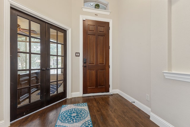 entryway with french doors and dark hardwood / wood-style flooring