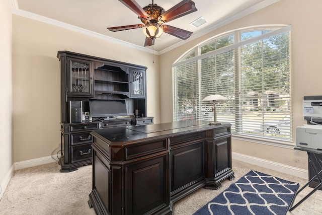 carpeted office with ornamental molding, a healthy amount of sunlight, and ceiling fan