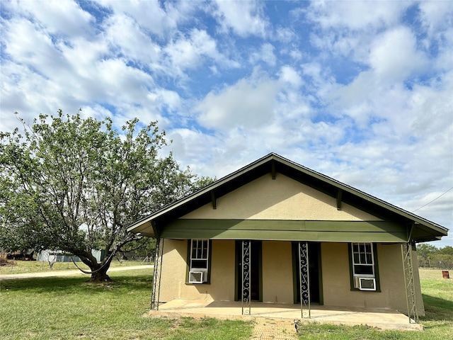 rear view of house with a lawn