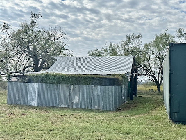 view of outbuilding with a lawn