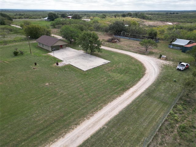 birds eye view of property with a rural view