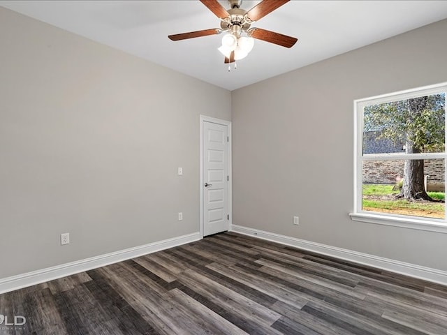 unfurnished room with ceiling fan and dark hardwood / wood-style flooring