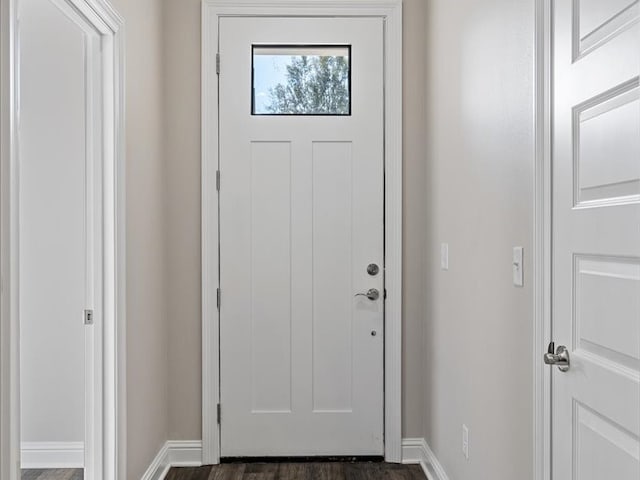 doorway with dark hardwood / wood-style flooring