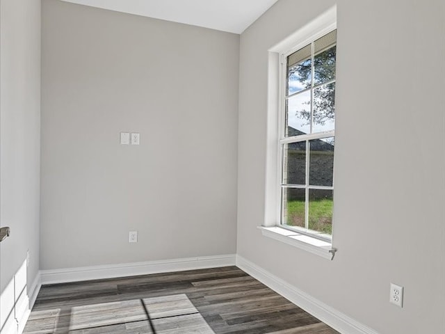 empty room featuring dark hardwood / wood-style floors