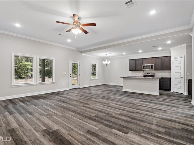 unfurnished living room featuring ornamental molding, ceiling fan with notable chandelier, and dark hardwood / wood-style flooring