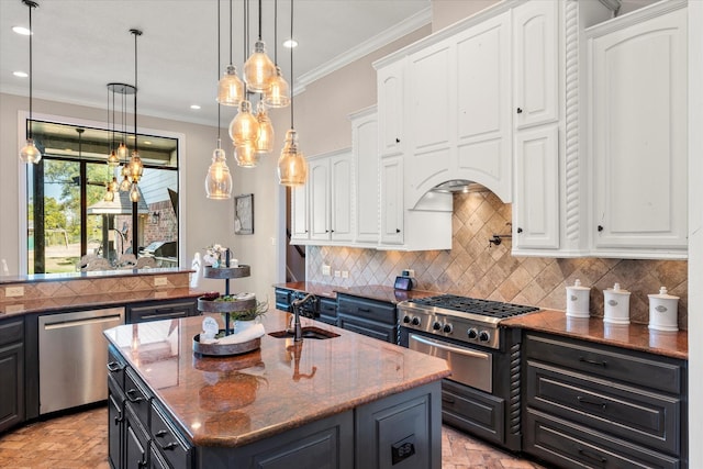 kitchen with white cabinetry, dishwasher, backsplash, an island with sink, and dark stone counters