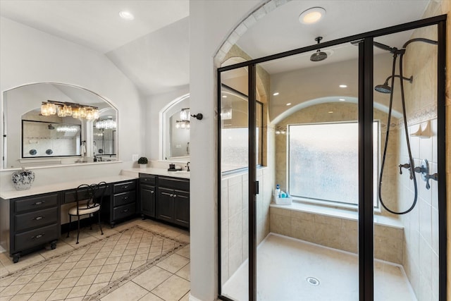 bathroom featuring tile patterned floors, vanity, an enclosed shower, and vaulted ceiling