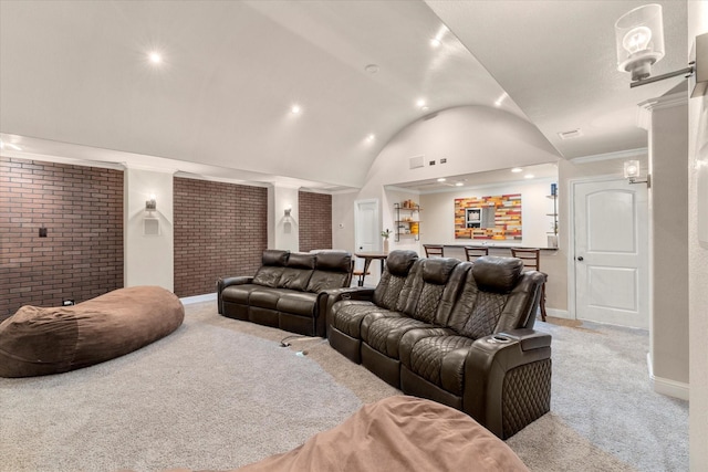 home theater with light colored carpet, vaulted ceiling, and ornamental molding