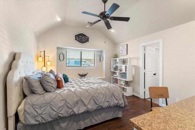 bedroom with dark hardwood / wood-style flooring, vaulted ceiling, and ceiling fan