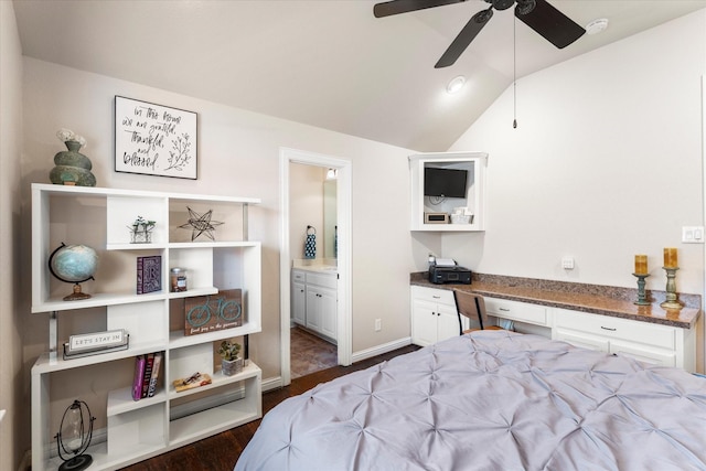 bedroom with lofted ceiling, ensuite bathroom, ceiling fan, dark hardwood / wood-style floors, and built in desk