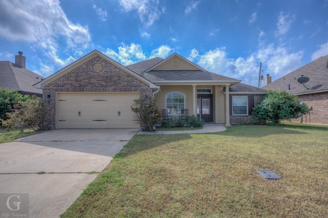 view of front of house featuring a front yard and a garage