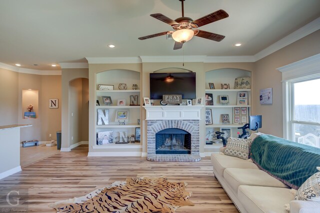 bedroom with ensuite bath, crown molding, a raised ceiling, carpet floors, and ceiling fan