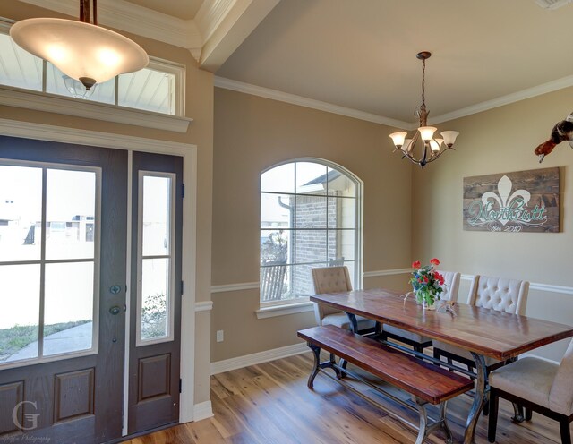 kitchen with sink, appliances with stainless steel finishes, crown molding, and light tile patterned floors