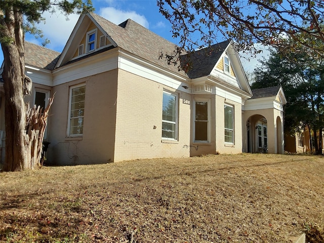 view of property exterior featuring a yard