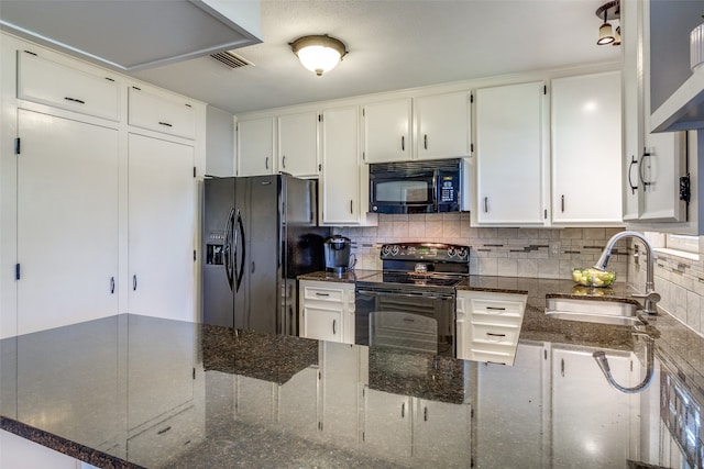 kitchen with backsplash, dark stone counters, sink, black appliances, and white cabinetry