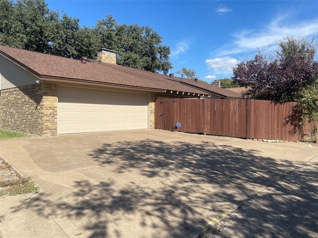 view of property exterior with a garage