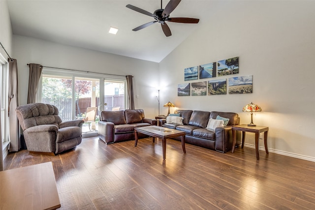 living room featuring dark hardwood / wood-style floors, high vaulted ceiling, and ceiling fan