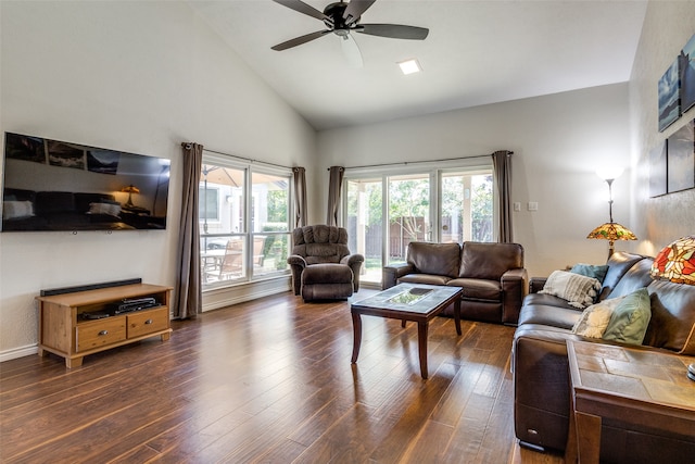 living room featuring dark hardwood / wood-style floors, high vaulted ceiling, and ceiling fan