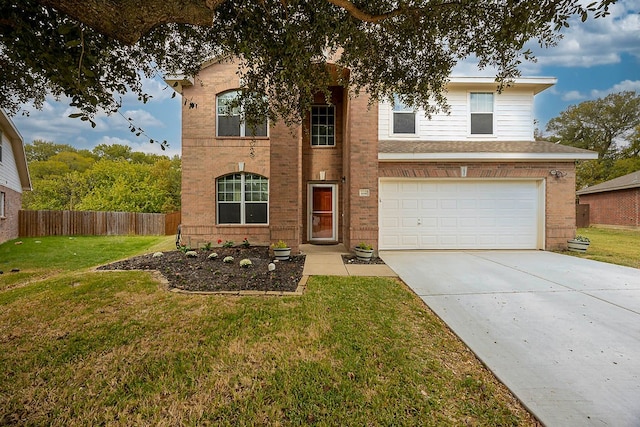 view of front of home featuring a garage and a front yard