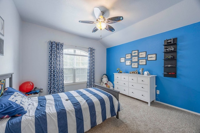 carpeted bedroom with lofted ceiling and ceiling fan