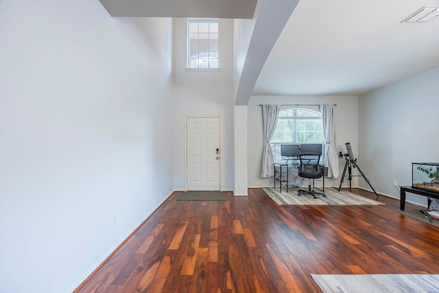 entrance foyer featuring dark hardwood / wood-style floors