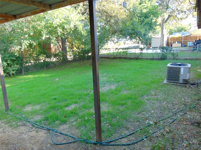 view of yard featuring central air condition unit