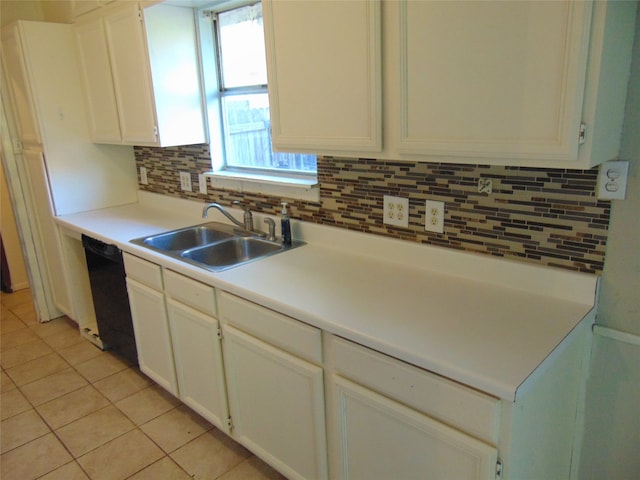 kitchen with white cabinetry, dishwasher, sink, decorative backsplash, and light tile patterned floors