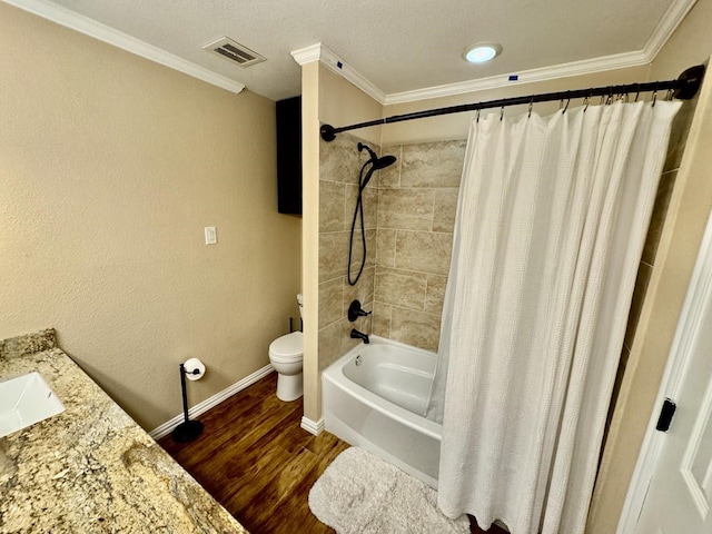 full bathroom with hardwood / wood-style flooring, crown molding, shower / bath combo, and toilet