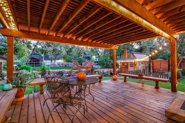 wooden deck featuring an outbuilding