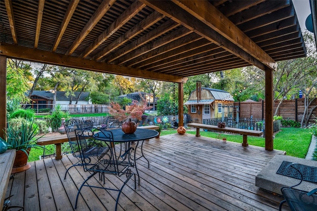 wooden terrace featuring an outdoor structure