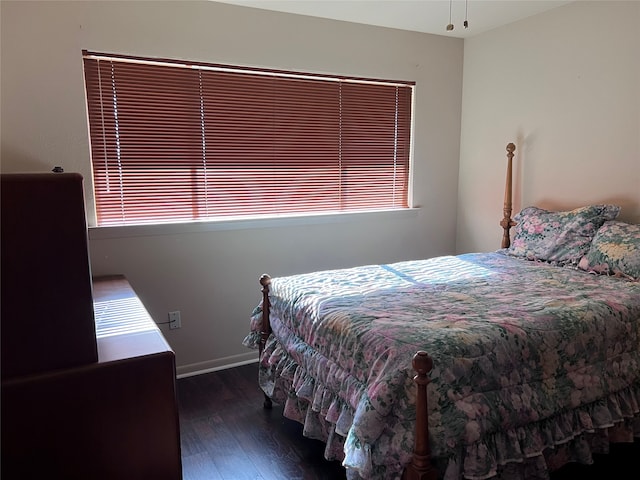 bedroom featuring dark wood-type flooring