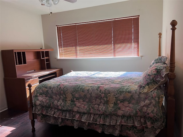 bedroom with ceiling fan and dark hardwood / wood-style floors