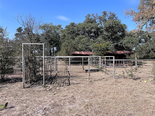 view of yard with an outbuilding and a rural view