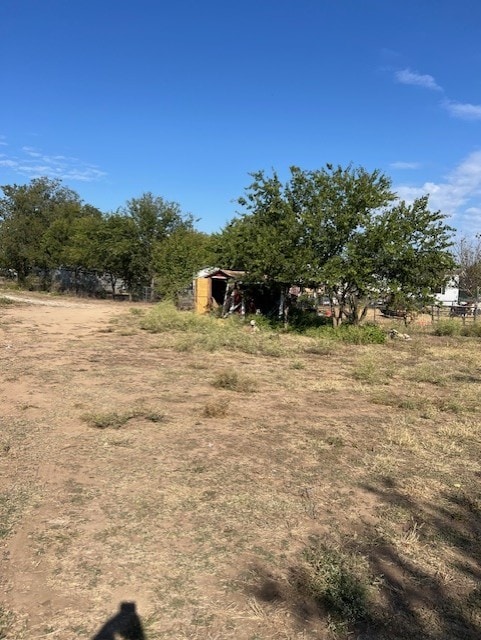 view of yard with a rural view