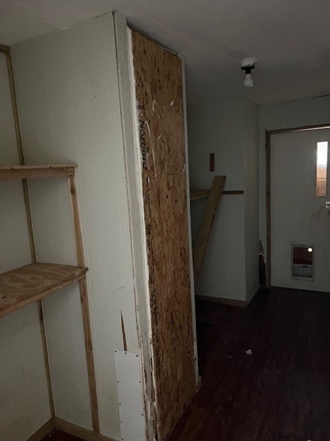 hallway with hardwood / wood-style flooring