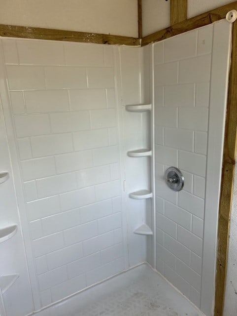 bathroom with tiled shower