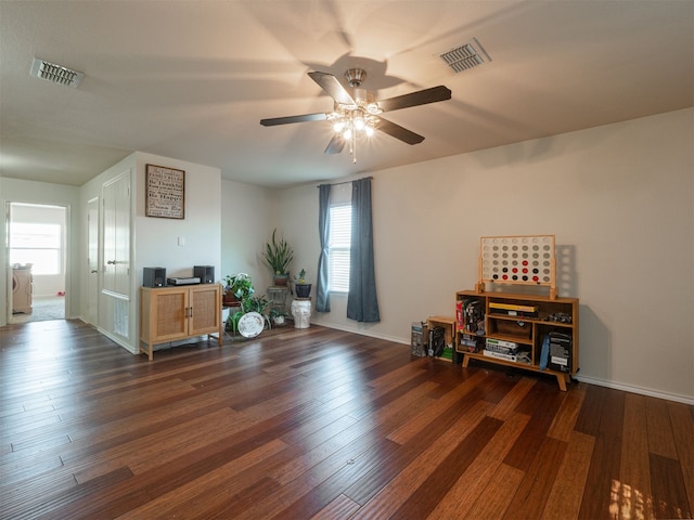 miscellaneous room with plenty of natural light, dark wood-type flooring, and ceiling fan