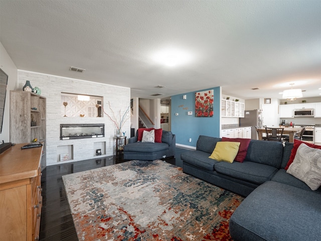 living room with a textured ceiling