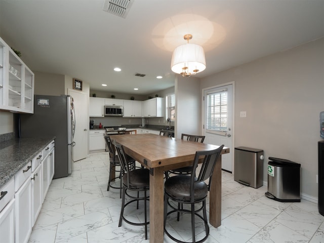 dining area featuring sink