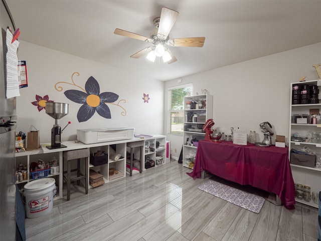 bedroom featuring ceiling fan and light hardwood / wood-style flooring