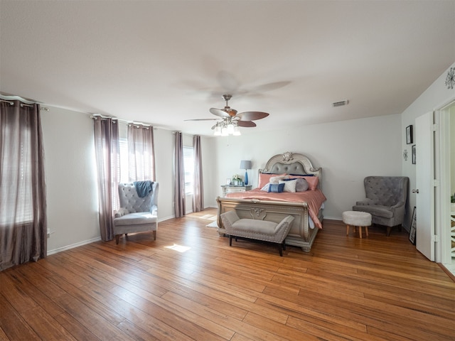 bedroom with ceiling fan and light hardwood / wood-style flooring