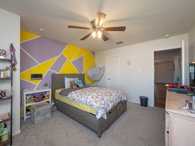 carpeted bedroom with ceiling fan