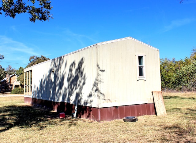 view of property exterior featuring a yard