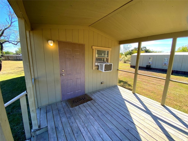 wooden deck with cooling unit and a yard