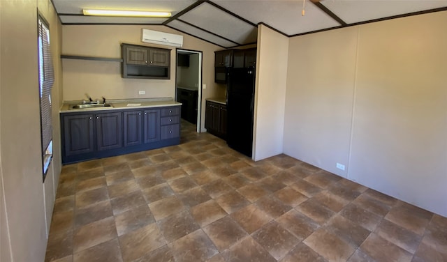 kitchen with lofted ceiling, black appliances, a wall unit AC, and sink