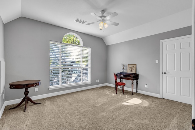 misc room featuring lofted ceiling, ceiling fan, carpet flooring, and plenty of natural light