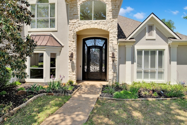4604 Wisdom Creek Ct, Flower Mound, TX 75022 - view of exterior entry with roof with shingles, stucco siding, stone siding, and a standing seam roof