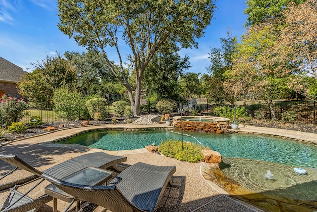 view of pool with an in ground hot tub and a patio