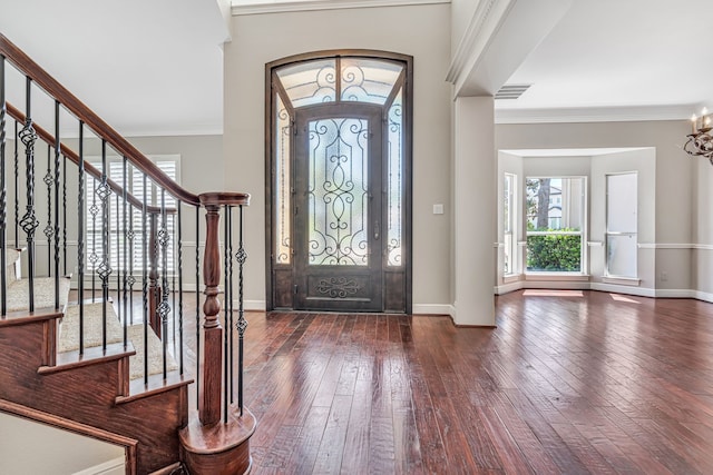 4604 Wisdom Creek Ct, Flower Mound, TX 75022 - entrance foyer with crown molding, baseboards, dark wood-style floors, and visible vents